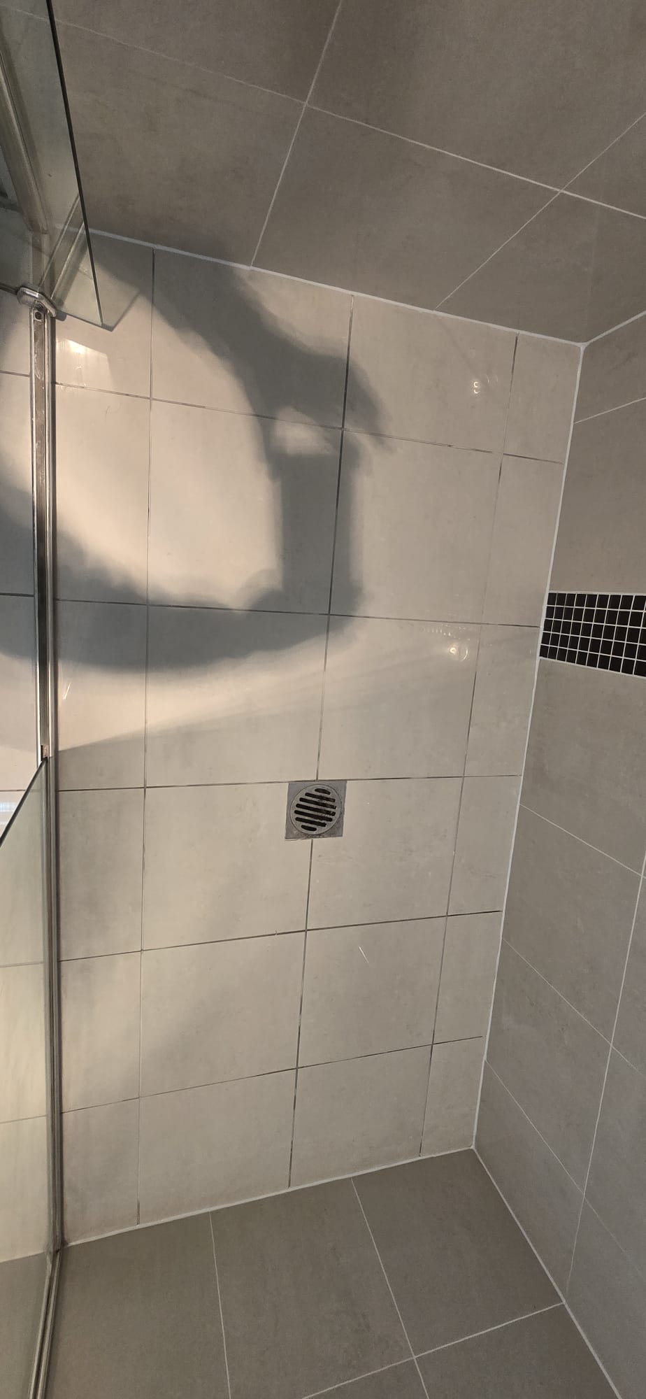 Shower after grout restoration and resealing work
